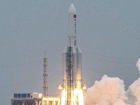 This file photo taken on April 29, 2021 shows a Long March 5B rocket, carrying China's Tianhe space station core module, lifting off from the Wenchang Space Launch Center in southern China's Hainan province.