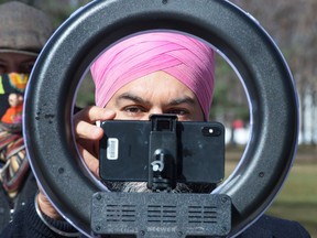 NDP Leader Jagmeet Singh adjusts his webcam prior to a news conference on March 29, 2021, in Montreal.