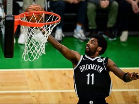 Kyrie Irving of the Brooklyn Nets drives to the basket against the Boston Celtics during Game 4 of the Eastern Conference first round series at TD Garden on May 30, 2021 in Boston, Mass.