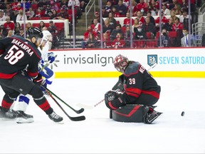 Tampa Bay Lightning center Brayden Point scores a second period goal past Carolina Hurricanes goaltender Alex Nedeljkovic in Game 1 of the second round of the 2021 Stanley Cup Playoffs at PNC Arena in Raleigh, N.C., May 30, 2021.