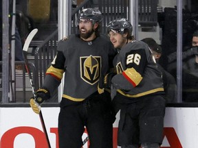 Golden Knights forwards Alex Tuch, left, and Mattias Janmark celebrate after Tuch assisted on Janmark's third goal of the game into an empty net against the Wild in Game 7 of the First Round of the 2021 Stanley Cup Playoffs at T-Mobile Arena in Las Vegas, Friday, May 28, 2021.