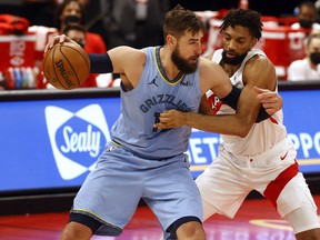 Memphis Grizzlies centre Jonas Valanciunas drives to the basket against Toronto Raptors centre Khem Birch on Saturday.