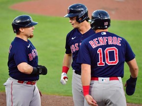 Bobby Dalbec (centre) of the Red Sox celebrates with Christian Vazquez (left) and Hunter Renfroe (rigth) after scoring in the second inning against the Blue Jays at TD Ballpark in Dunedin, Fla., Thursday, May 20, 2021.