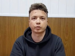 Belarusian blogger Roman Protasevich, detained when a Ryanair plane was forced to land in Minsk, is seen in a pre-trial detention facility, as he says, in Minsk, Belarus, Monday, May 24, 2021 in this still image taken from video.