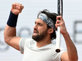 Georgia's Nikoloz Basilashvili celebrates winning against Germany's Jan-Lennard Struff during the final match of the ATP tennis tournament in Munich, southern Germany, on May 2, 2021.