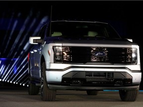 In this photo taken May 19, 2021, Ford Motor Company unveils their new electric F-150 Lightning outside of their headquarters in Dearborn, Michigan.