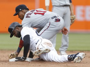 Detroit Tigers shortstop Niko Goodrum slides safe into second base with a double against Minnesota Twins second baseman Jorge Polanco during the fourth inning at Comerica Park.