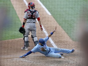 Texas Rangers shortstop Isiah Kiner-Falefa (9) scores a run in the eighth inning against the Boston Red Sox at Globe Life Field in Arlington, Texas, on May 2, 2021.