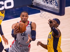 Washington Wizards guard Russell Westbrook drives to the basket during the second half of an NBA basketball game against the Indiana Pacers at Bankers Life Fieldhouse.