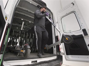 Mateo Rodriguez unloads a dozen Bird e-scooters on Wednesday, May 5, 2021 in downtown Windsor after the company briefly suspended service.