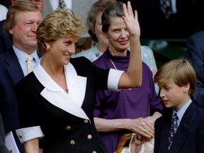 The Princess of Wales, accompanied by her son Prince William, arrives at Wimbledon's Centre Court before the start of the Women's Singles final July 2.