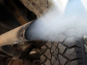 The exhaust pipe of a running motor vehicle is shown in this file photo.