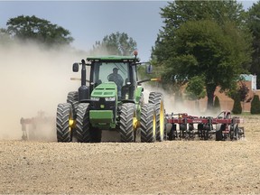 LAKESHORE, ONTARIO. MAY 20, 2021 - A farmer works on land near St. Joachim in Lakeshore, Ontario on Thursday, May 20, 2021. Ontario growers are worried over the rapid pace of disappearing farmland due to urban sprawl.