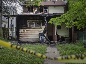 Extensive damage can be seen to the rear of a home at 747 Windsor Ave. after an early morning fire on Monday, May 30, 2021.