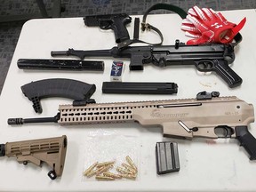 Illegal firearms (including an improvised silencer) that were seized by Windsor police on May 12, 2021.