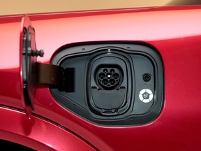 FILE PHOTO: The charging socket is seen on Ford Motor Co's all-new electric Mustang Mach-E vehicle during a photo shoot at a studio in Warren, Michigan, U.S. October 29, 2019.