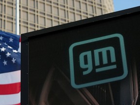 FILE PHOTO: The new GM logo is seen on the facade of the General Motors headquarters in Detroit, Michigan, U.S., March 16, 2021. Picture taken March 16, 2021.