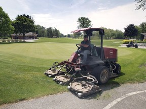 Kevin Sexton cuts the grass at the Roseland Golf Course in Windsor on Thursday, May 20, 2021. The province announced that outdoor amenities such as golf courses can open this upcoming Saturday.