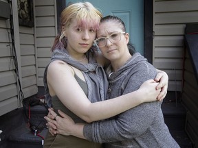 Augustina Sevelka, 18, left, and her mother Candace Petre are shown at their Windsor home on Thursday, May 20, 2021. The teenager was hit by a vehicle on Monday while riding her bike. The driver fled the scene.