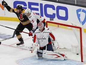 After stealing the puck from Washington Capitals defenseman Justin Schultz, Boston Bruins right wing Craig Smith celebrates his winning goal on goaltender Ilya Samsonov during the second overtime in game three of the first round of the 2021 Stanley Cup Playoffs at TD Garden.