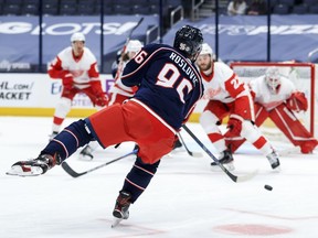 May 8, 2021; Columbus, Ohio, USA; Columbus Blue Jackets center Jack Roslovic (96) shoots and scores a goal against the Detroit Red Wings in the third period at Nationwide Arena. Mandatory Credit: Aaron Doster-USA TODAY Sports