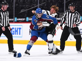 Los Angeles Kings left wing Brendan Lemieux and Colorado Avalanche defenseman Ryan Graves fight during the second period at Ball Arena.
