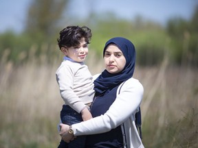 Khawla Khalifa, who says her husband kidnapped two of her children in 2019 and brought them to Lebanon, is pictured with her youngest son, Zein Zeidan, 4, by their home in South Windsor on Saturday, May 1, 2021.