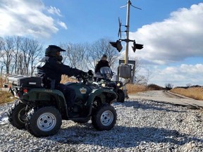 OPP officers patrolling on all-terrain vehicles are shown in this undated handout image.