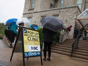 West Windsor residents wait in line for a COVID-19 vaccination clinic at Mackenzie Hall on May 3, 2021.