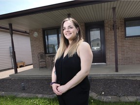 Rebecca Sellan, a recent University of Windsor graduate, stands outside her parent's home in Windsor's Remington Park area on May 20, 2021.