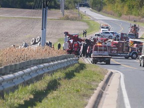 Firefighters and police respond to a multi-vehicle collision on Lauzon Parkway at Twin Oaks Drive in Windsor on May 12, 2021.