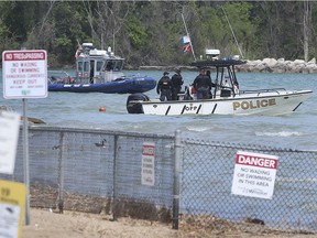 WINDSOR, ONTARIO. MAY 27, 2021 - Officers with the Windsor Police and OPP marine units search for the body of a man on Thursday, May 27, 2021 near the Sand Point Beach in Windsor.