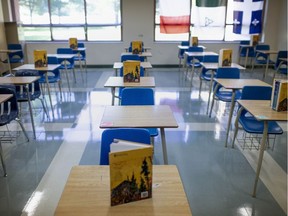 Still no plans for classroom return in Ontario. In this Aug. 6, 2020, file photo, a classroom prepared with social distancing measures in place is shown at St. Thomas of Villanova Catholic High School in LaSalle.