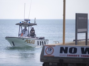 An OPP marine unit searches the water between Windsor's Lakeview Park Marina and Sand Point Beach on May 25, 2021.