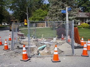 A sinkhole at the corner of Wyoming Avenue and Oxley Avenue in LaSalle is pictured on Wednesday, May 19, 2021.