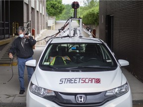 StreetScan driver Alan Rowlandson prepares his specially equipped vehicle used to study Essex County roadways on May 26, 2021.