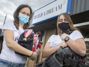 Rebecca Chenier, left, and Delaney Krieger, are pictured outside the offices of Build A Dream, on Saturday, May 8, 2021.