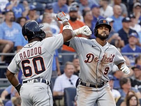 Willi Castro of the Detroit Tigers is congratulated by Akil Baddoo #60 after hitting a two-run home run during the 4th inning of the game against the Kansas City Royals at Kauffman Stadium on June 14, 2021 in Kansas City, Missouri.