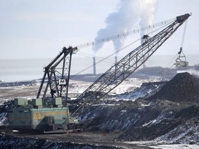 A giant drag line works in the Highvale Coal Mine to feed the nearby Sundance Power Plant near Wabamun, Alta., March 21, 2014.