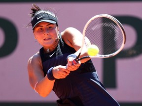 Bianca Andreescu plays a backhand in a first round match against Tamara Zidansek at the 2021 French Open at Roland Garros in Paris, May 31, 2021.