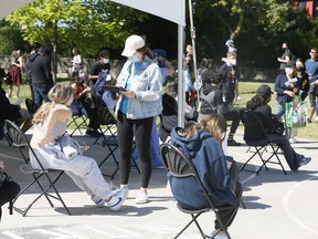 People at a vaccine pop-up at Jimmy Simpson Recreation Centre in Toronto on Thursday June 17, 2021.