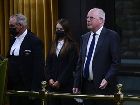 President of the Public Health Agency of Canada Iain Stewart, right, approaches the bar in the House of Commons to be admonished by the Speaker of the House of Commons Anthony Rota on Parliament Hill in Ottawa on Monday, June 21, 2021.