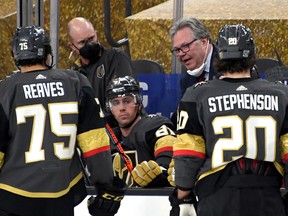 Vegas general manager Kelly McCrimmon talks to his players on the bench during a January game against the St. Louis Blues at T-Mobile Arena.