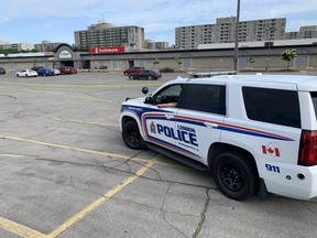 London police on Monday cordoned off a section of the parking lot in Cherryhill Mall, where a man, 20, was arrested following a crash in the city’s northwest end that left four people dead. (Dale Carruthers/The London Free Press)