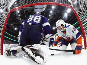 Mathew Barzal of the New York Islanders scores against Andrei Vasilevskiy of the Tampa Bay Lightning during Game 1 of the Stanley Cup semifinals at Amalie Arena on June 13, 2021 in Tampa