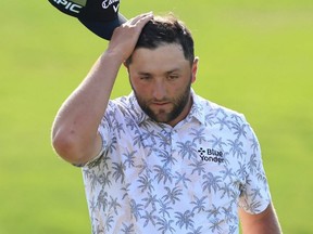 Jon Rahm reacts as he walks off the 18th green after completing his third round of The Memorial Tournament at Muirfield Village Golf Club in Dublin, Ohio, Saturday, June 5, 2021.