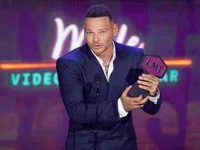 Singer Kane Brown accepts an award for Male Video of the Year for "Worship you" during the 2021 CMT Music Awards at Bridgestone Arena in Nashville, Tenn., June 9, 2021.