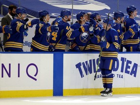Sabres defenceman Henri Jokiharju (10) celebrates with teammates after scoring a goal against the Flyers during the first period at KeyBank Center in Buffalo, N.Y., March 29, 2021.