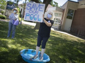 Susan Gold Smith stands participates in a rally with approximately 30 other people to prevent the closing of Adie Knox, on Thursday, June 17, 2021.