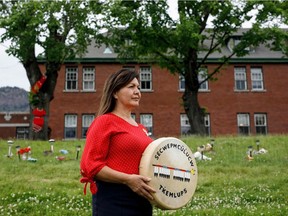 Tk’emlúps te Secwepemc Chief Rosanne Casimir pauses while speaking to reporters outside the former Kamloops Indian Residential School on Friday.